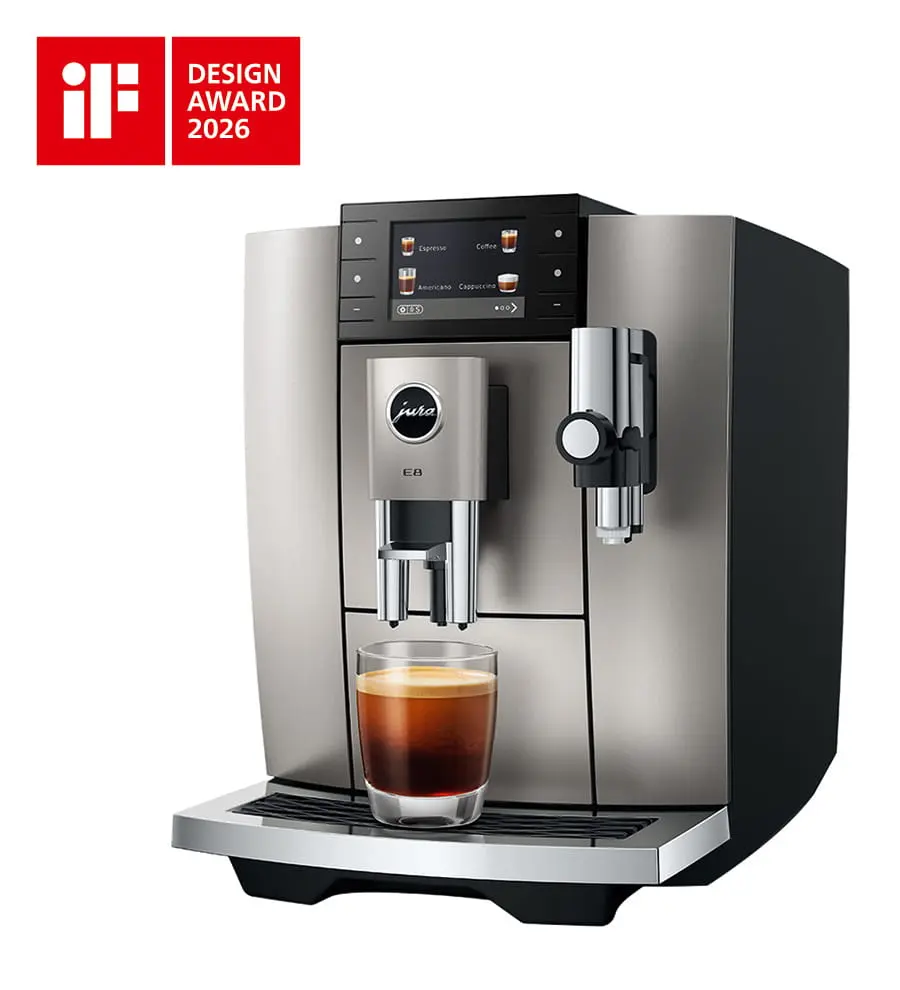 Machine à café JURA E8 Midnight Silver (SD) de face avec un café noir et le logo "Red Dot Award 2026".